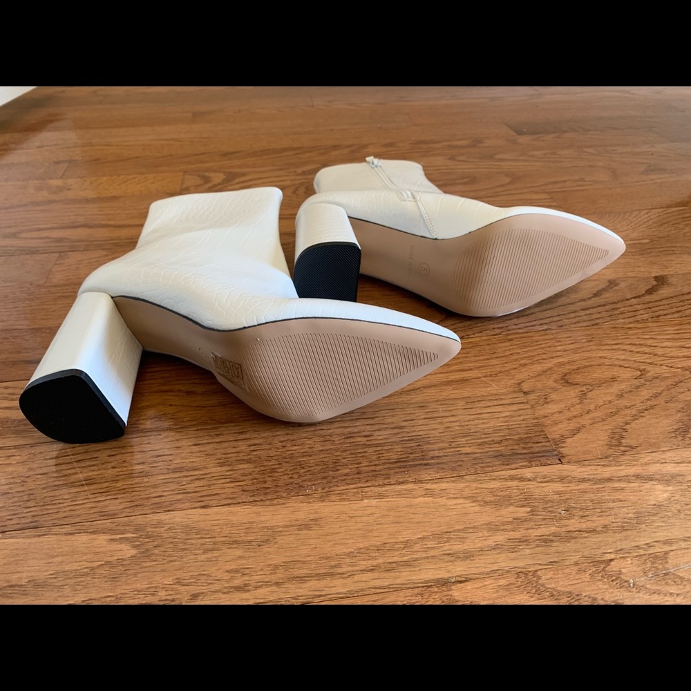 Ladies ankle booties. Never worn. Still in box.